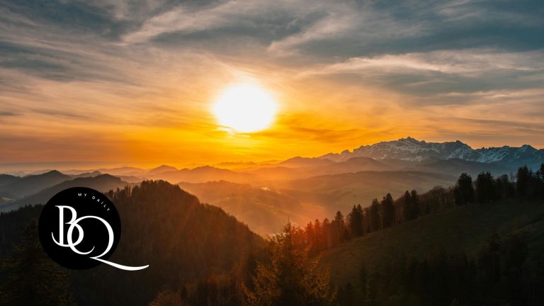 A serene sunrise over a mountain range