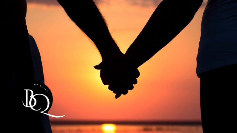 Couple holding hands in the sunset
