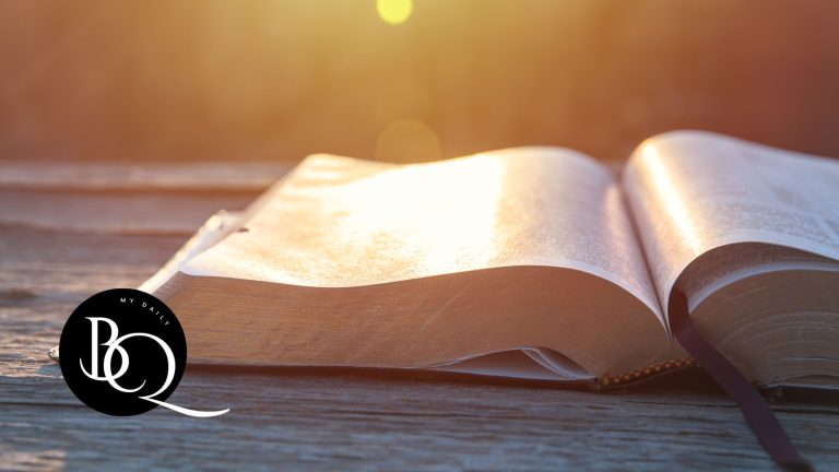 complete guide to understanding the Bible for beginners with an Open Bible on a wooden table with a warm glow from sunlight