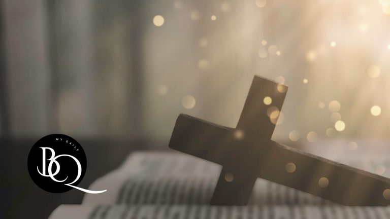 Open Bible with a cross and sunrise shining in